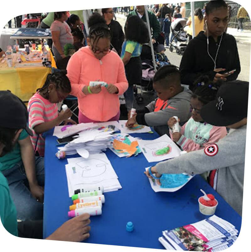 children outside making arts and crafts