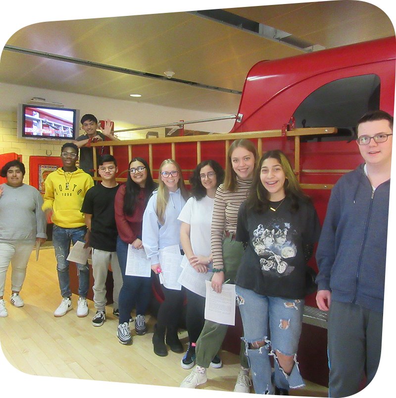 Volunteers standing in front of firetruck