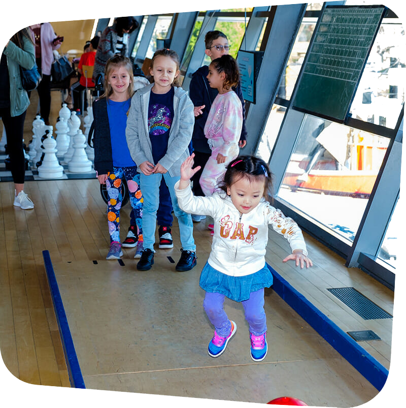 children playing bowling in big games exhibit