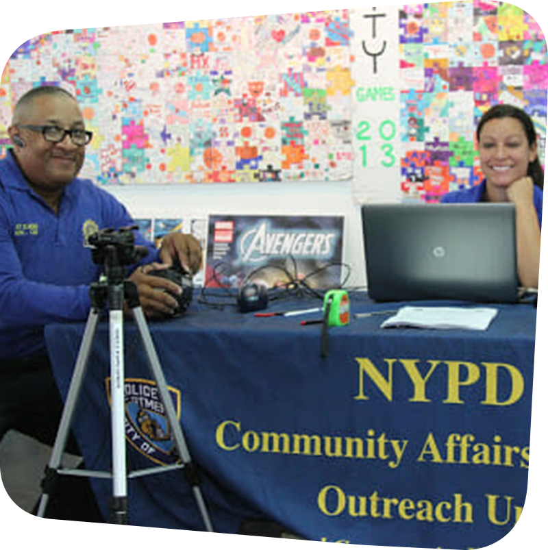 NYPD Community Affairs Bureau Outreach unit at table