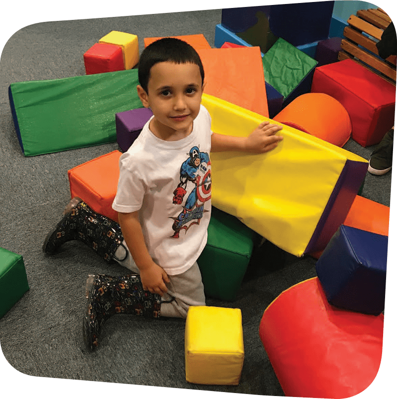 SICM_0012_I-Am-Going-to-the-Staten-Island-Children27s-Museum21-Visitors27-Guide-Oct-2018_Page_05_Image_0002 Child playing with colorful foam blocks