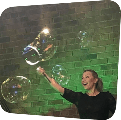 smiling woman surrounded by bubbles