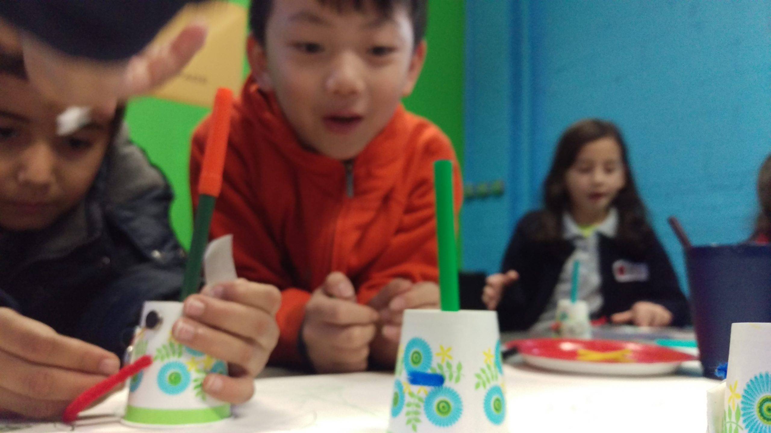 Children playing with robots they made