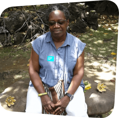 woman sitting on a bench looking down