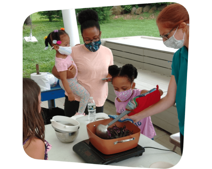 Becky_Helping_Girl_Stir_Pot