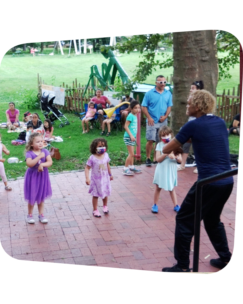 Walter leading three girls in a dance