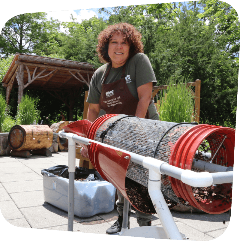 Woman operating Compost Machine