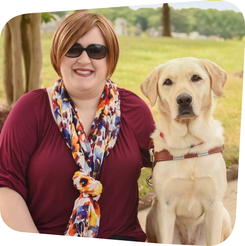 Holly Bonner sitting next to her guide dog Frances