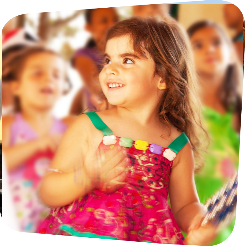 child in party dress smiling