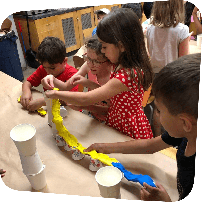 Campers working together on a project