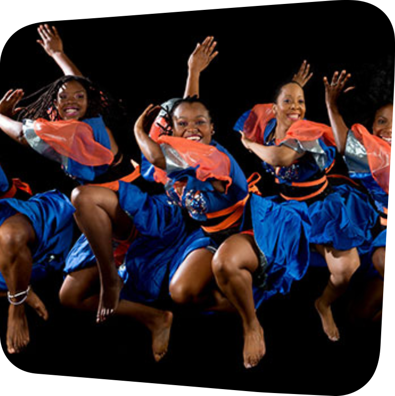 Dancers from the ASASE YAA Cultural Foundation dancing in blue and orange dress.