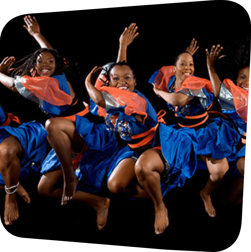 Dancers from the ASASE YAA Cultural Foundation dancing in blue and orange dress.