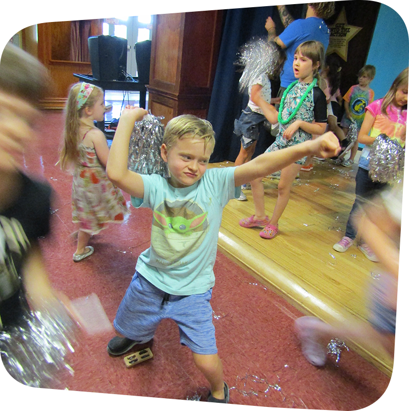 Boy dancing in Portia's Playhouse