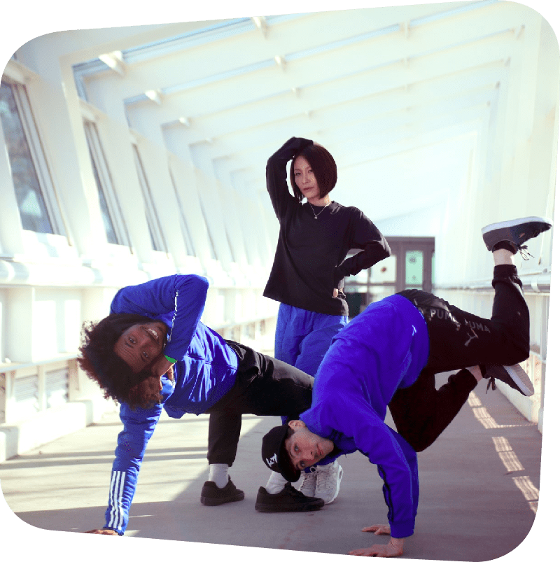 Three dancers in hip hop poses