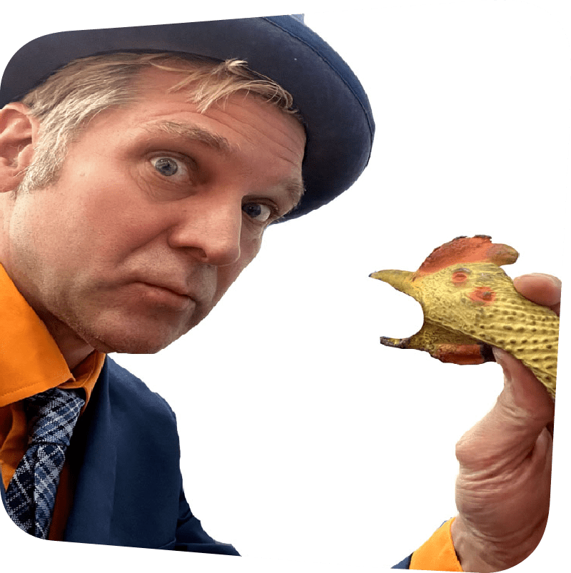 Rich the Juggler reacting to a rubber chicken with surprise and uncertainty