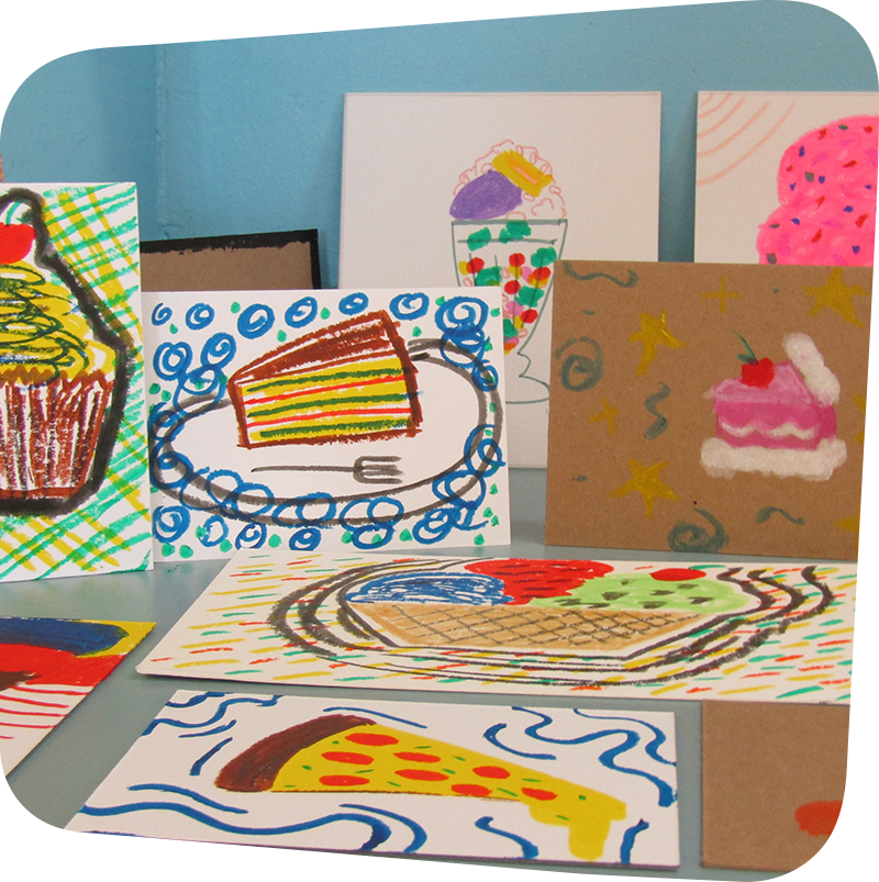 A variety of paintings and pastel drawings of foods such as pizza, fruit, cake and cupcakes
